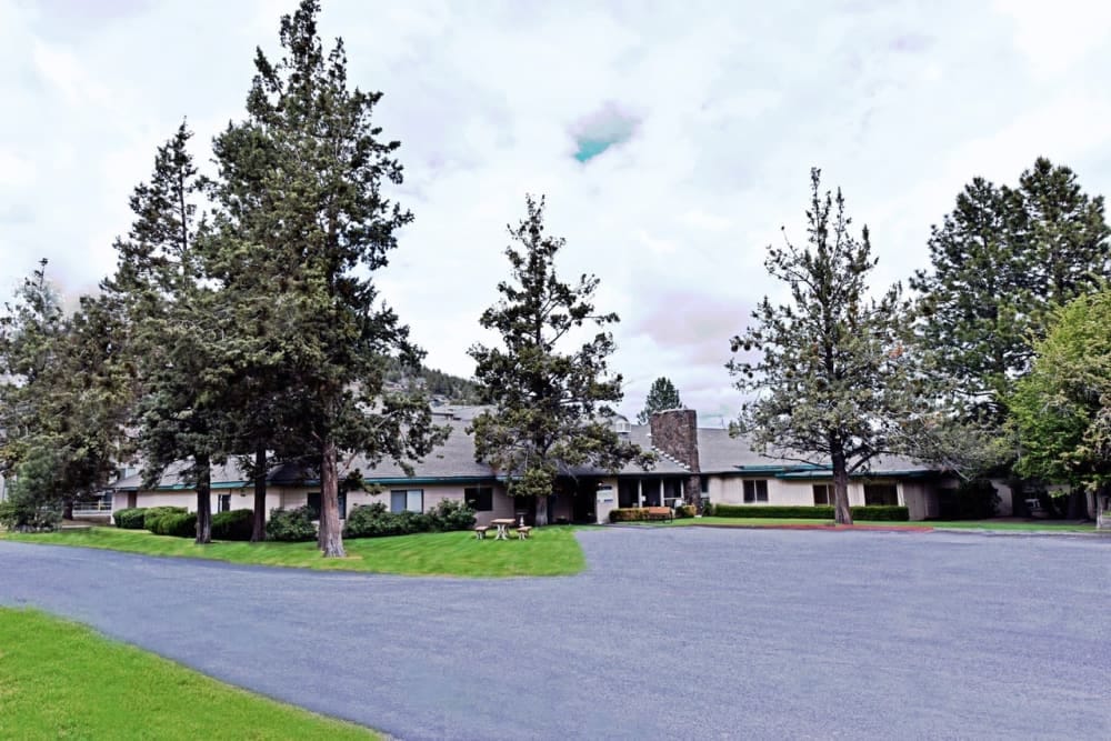 Exterior view of a senior living facility with trees