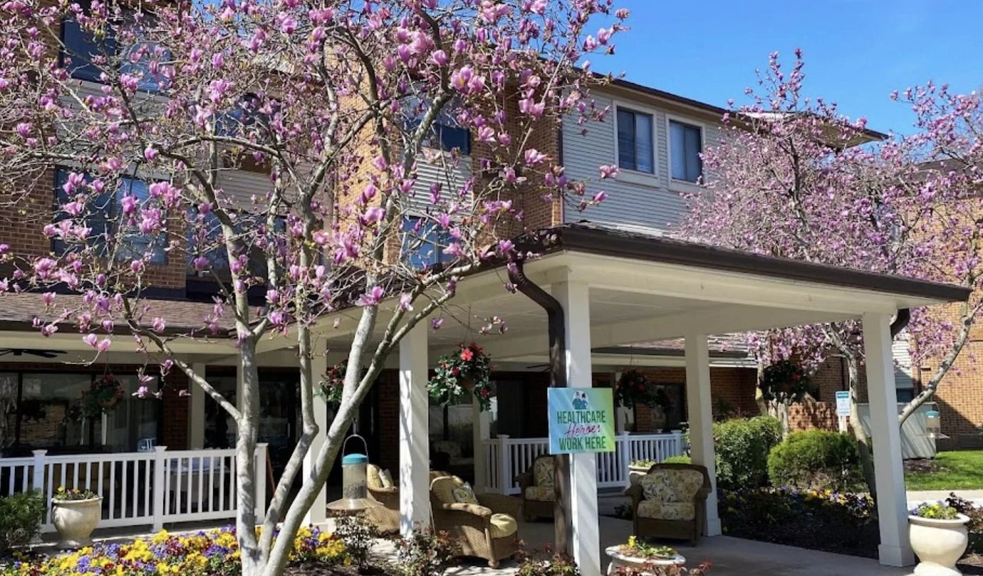 Exterior view of Potomac Place with blooming flowers