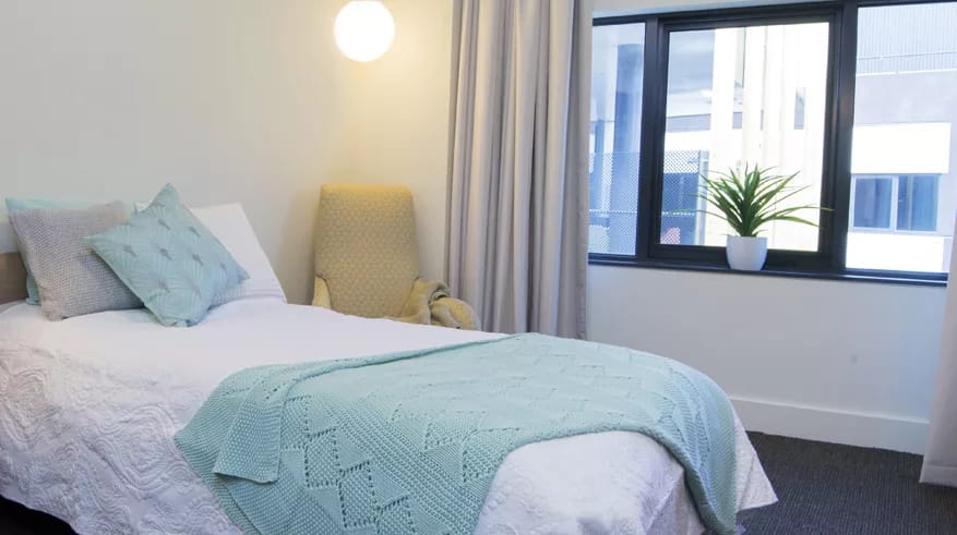 Comfortable resident room with a bed and natural light