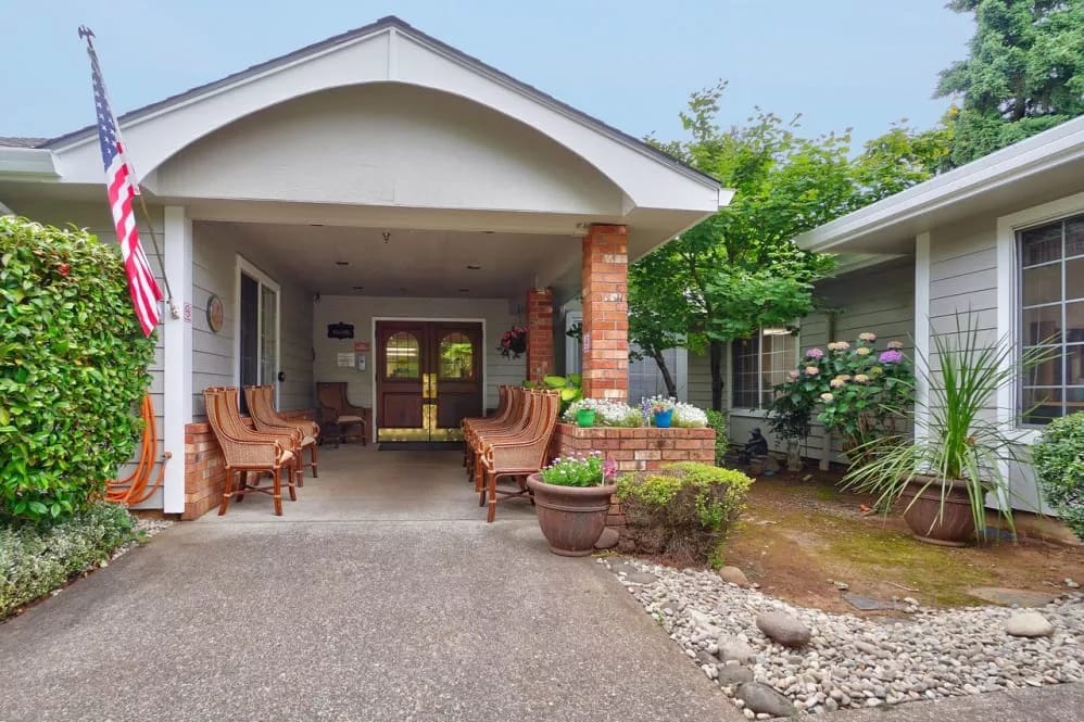 Entrance of Regency Woodland with outdoor seating