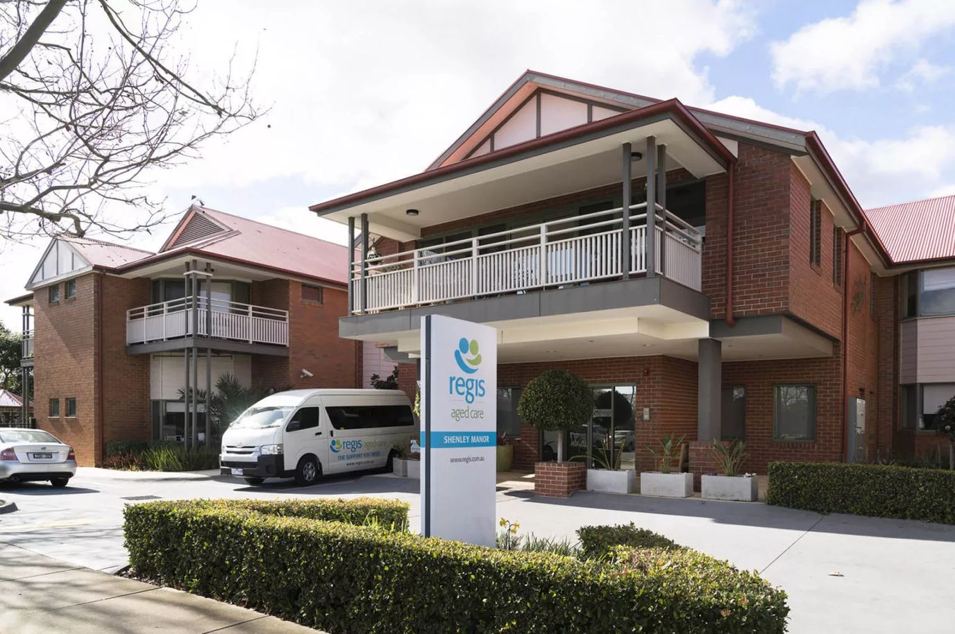 Exterior view of Regis Shenley Manor with signage