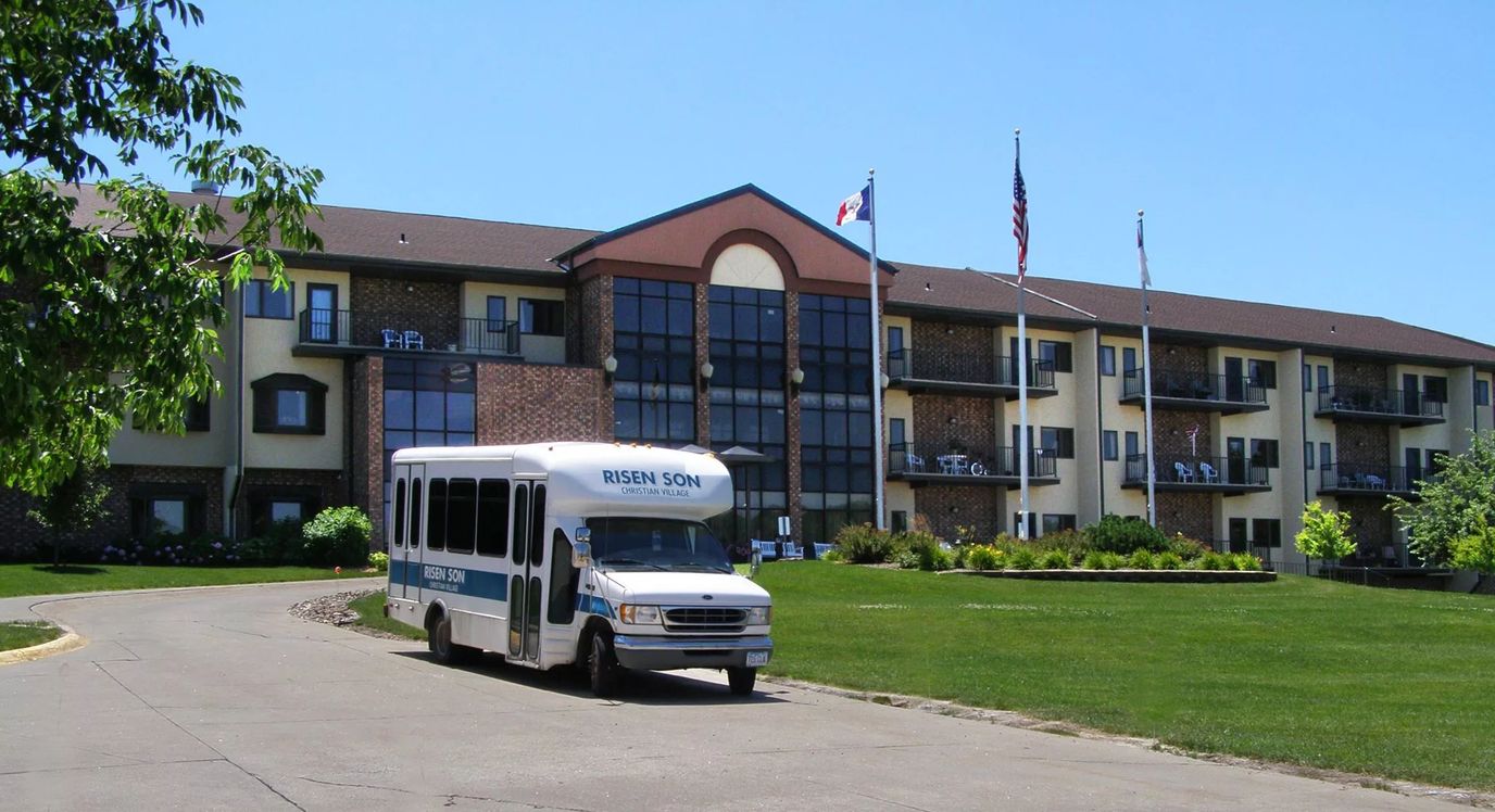 Exterior view of Risen Son Christian Village with transportation vehicle