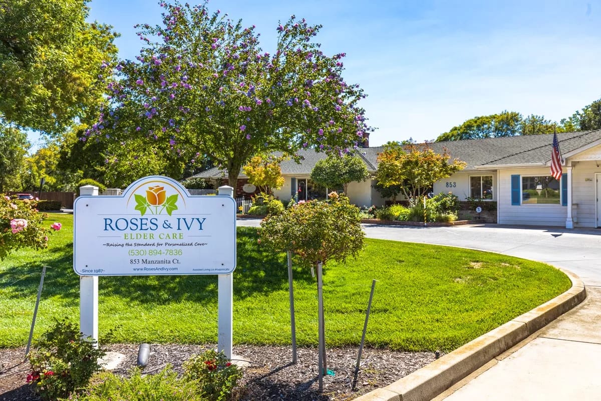Exterior of Roses & Ivy Elder Care facility with signage