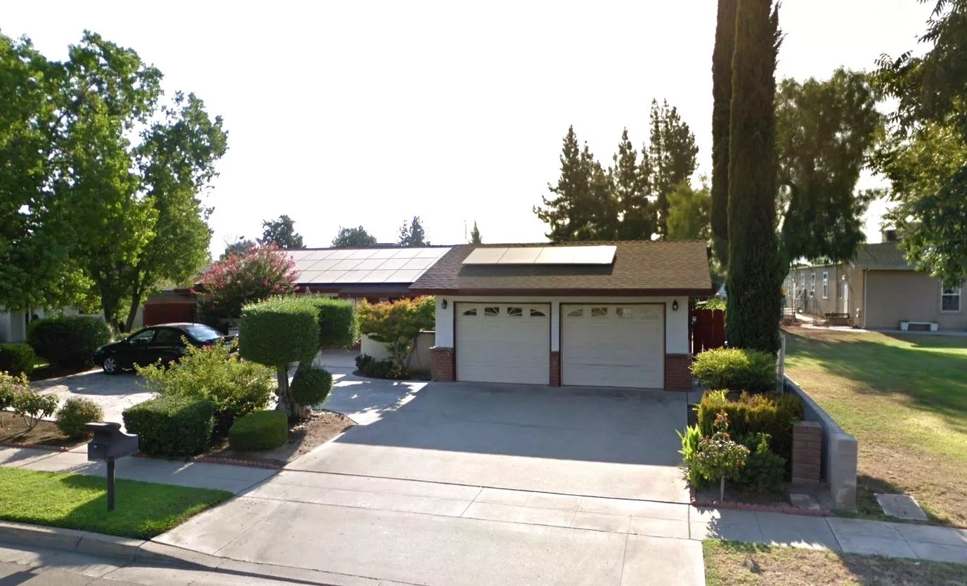 Exterior view of a residential building with garden