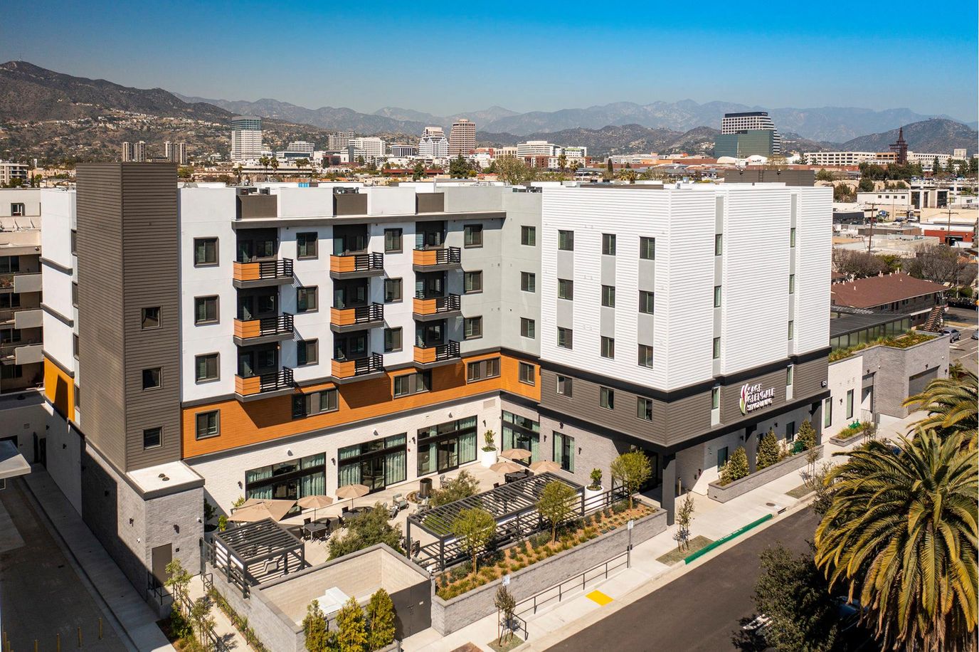Aerial view of a senior living facility with gardens