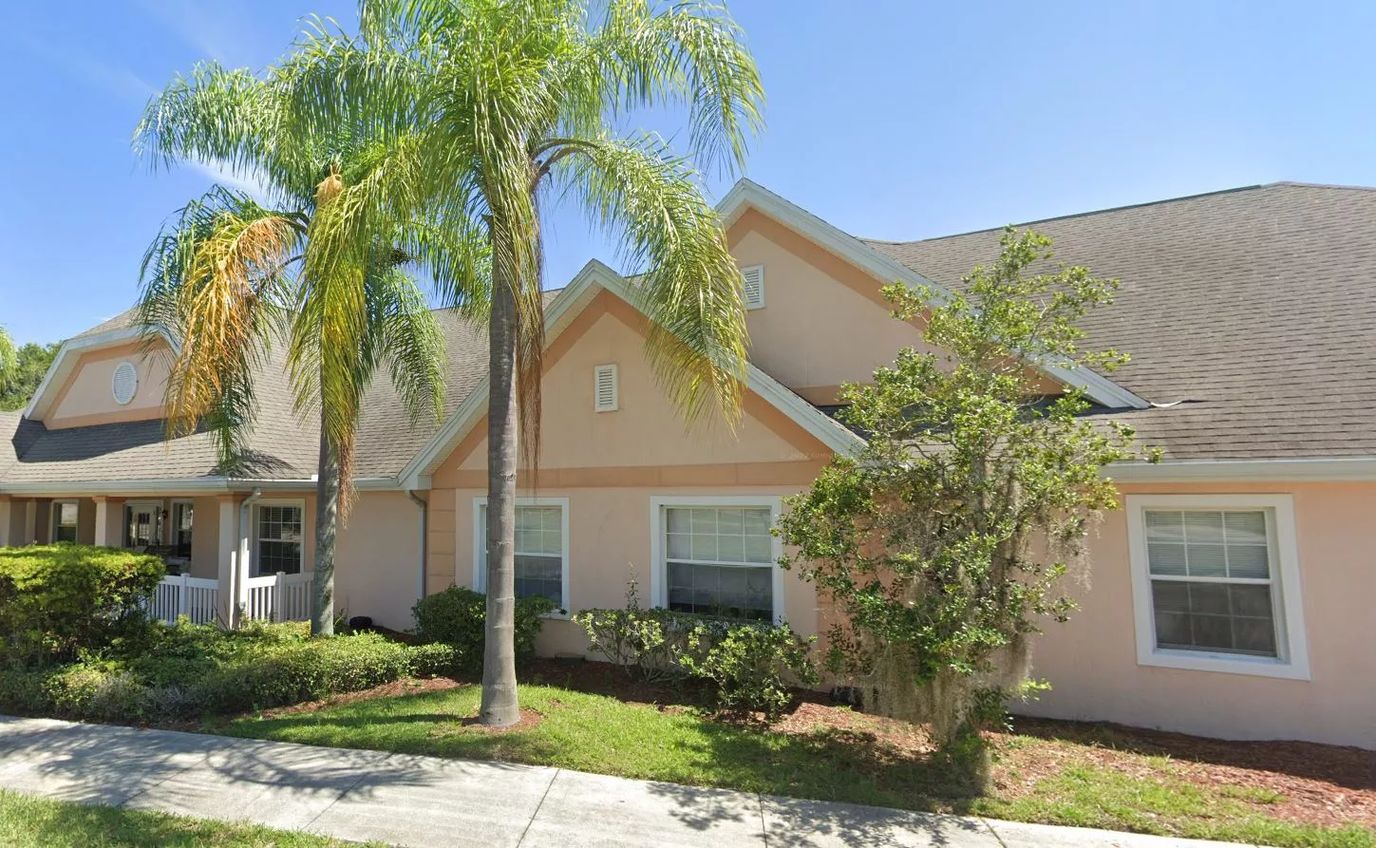 Exterior view of Savannah Cottage with palm trees
