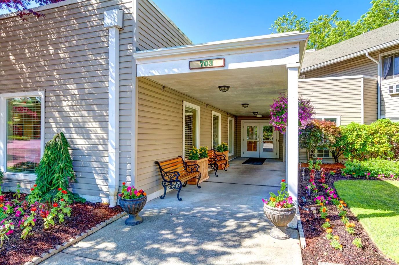 Entrance area of a senior living facility with flowers
