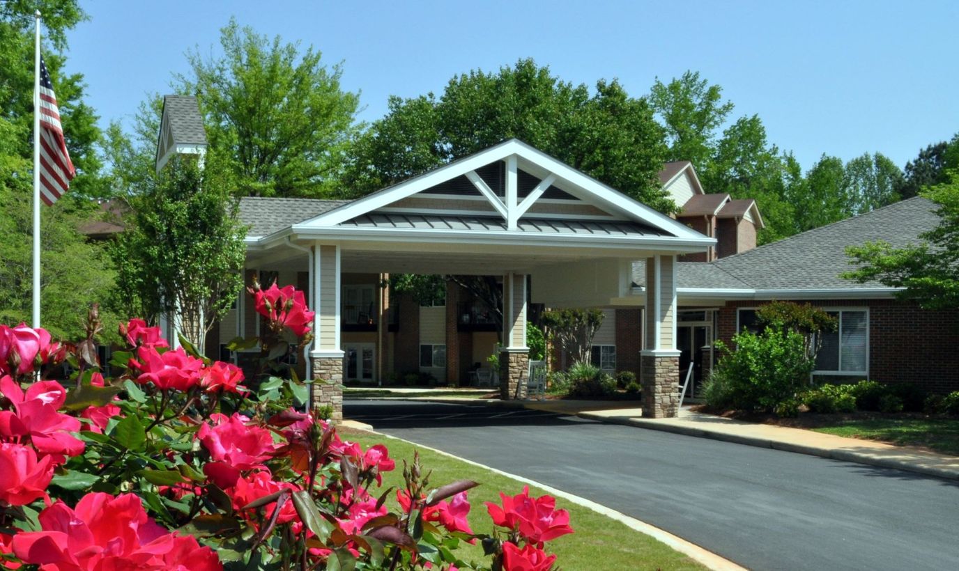 Entrance of St Mary's Highland Hills Village with flowers