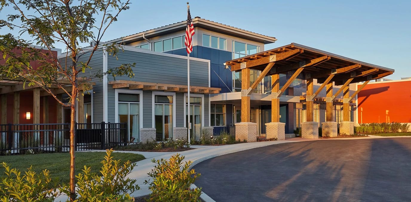 Exterior view of Stonecroft Health Campus with flag
