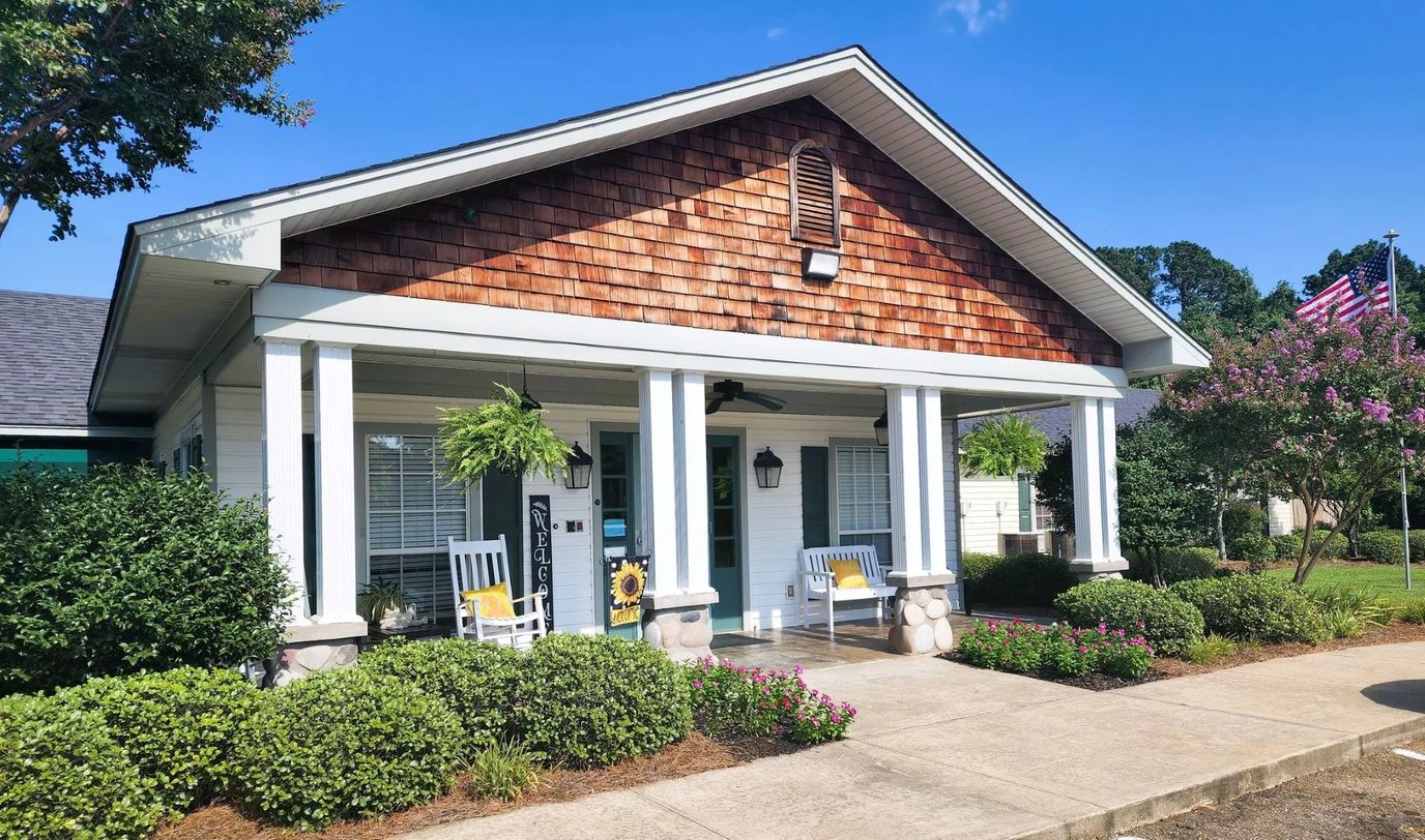 Exterior view of Stoneybrook Memory Care Home with seating area