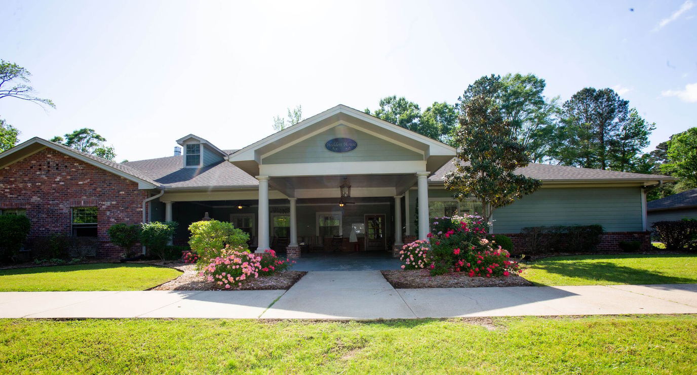 Exterior view of a senior living facility with landscaping