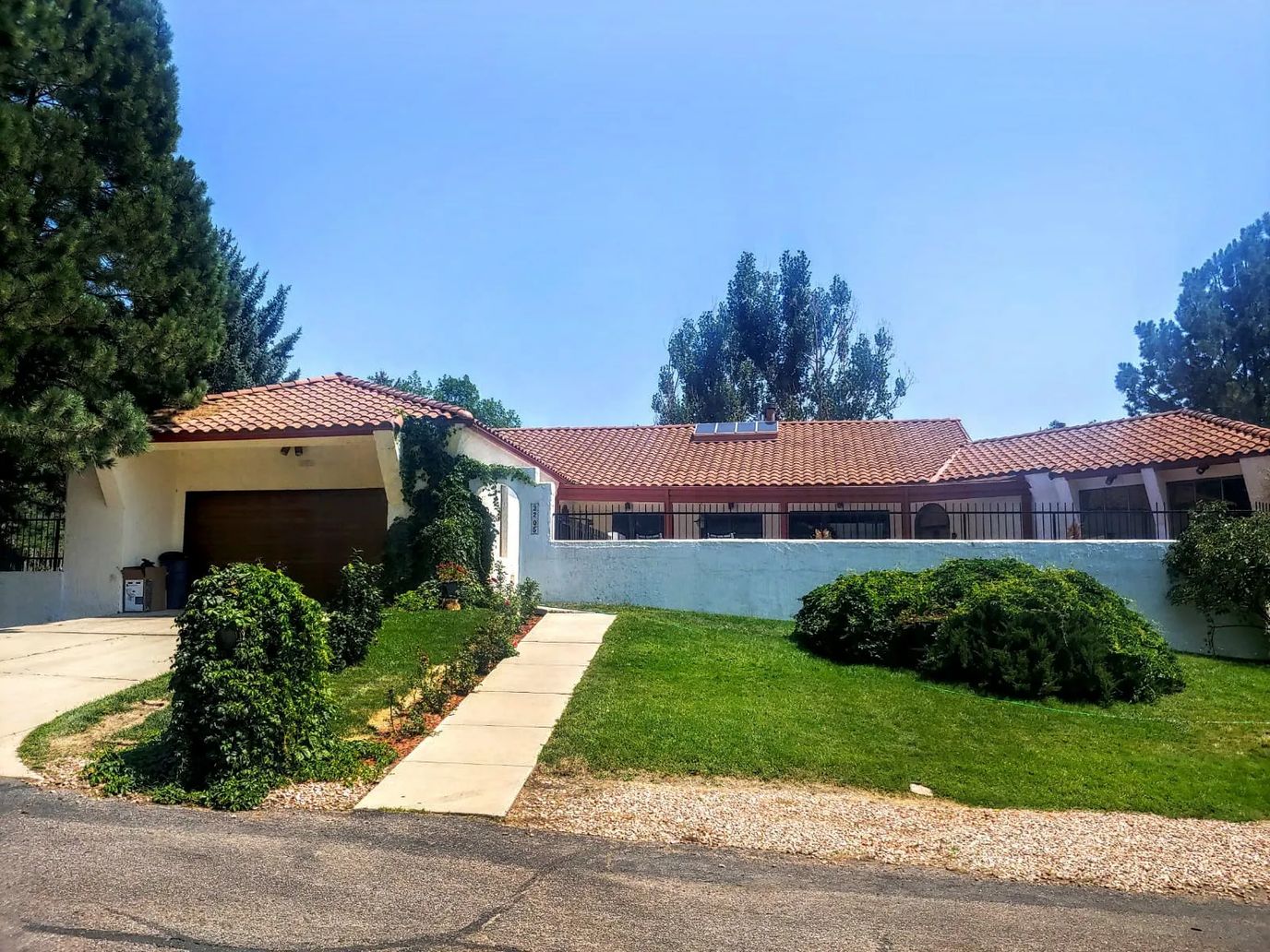 Exterior view of a senior living facility with landscaped garden