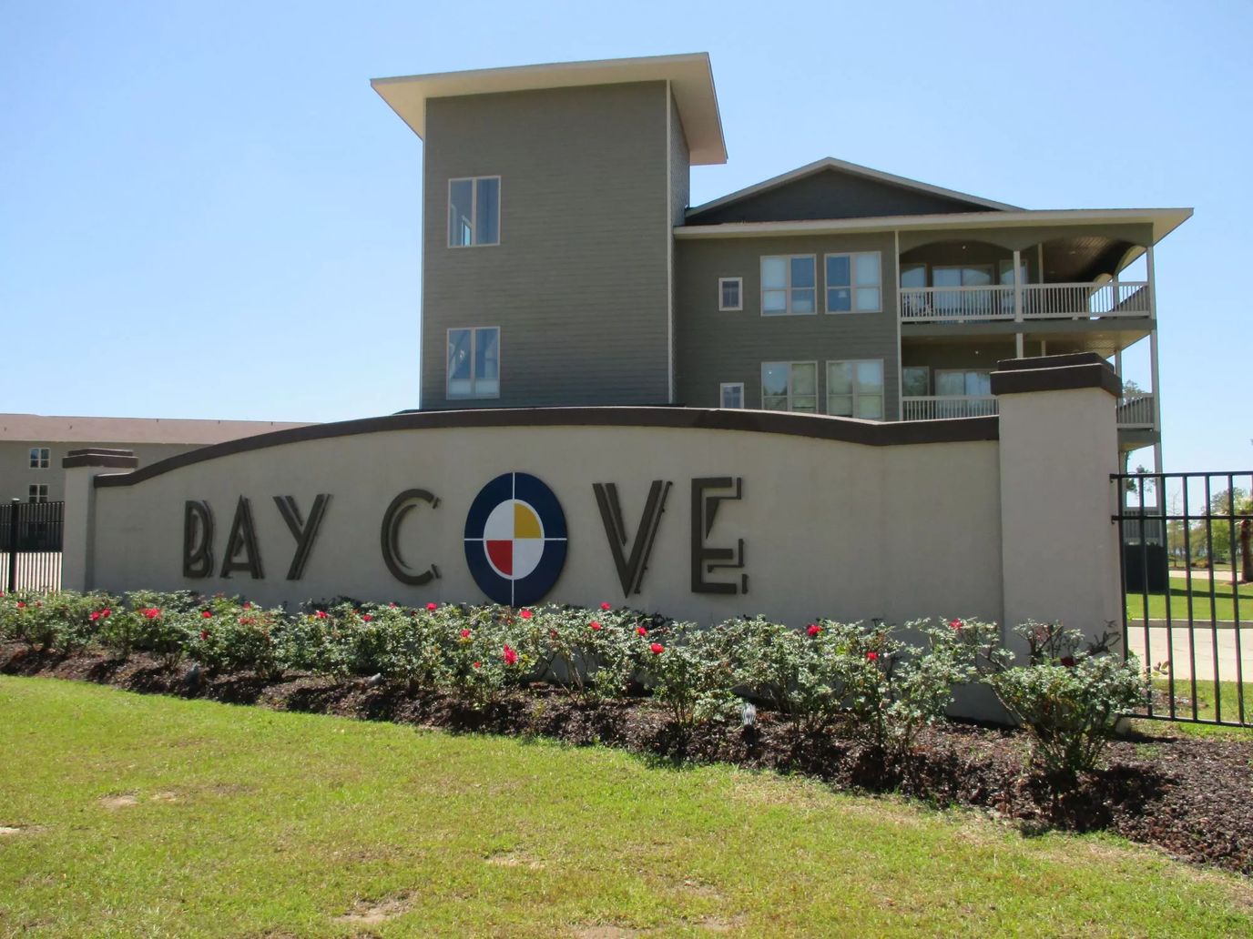 Exterior view of the Bay Cove building with signage