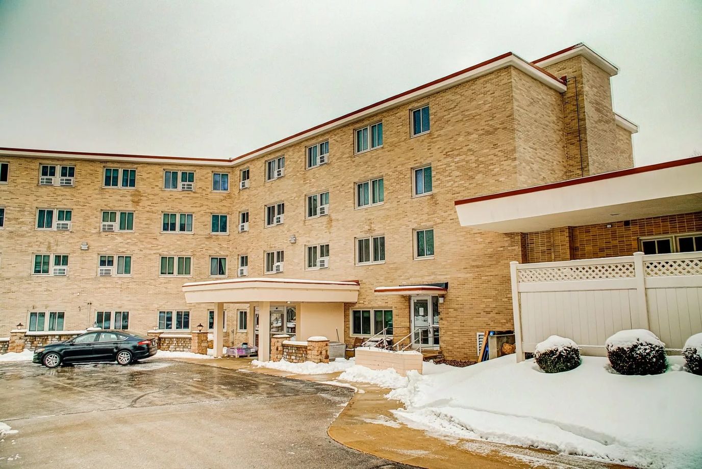 Exterior view of The Woods of Caledonia building in winter