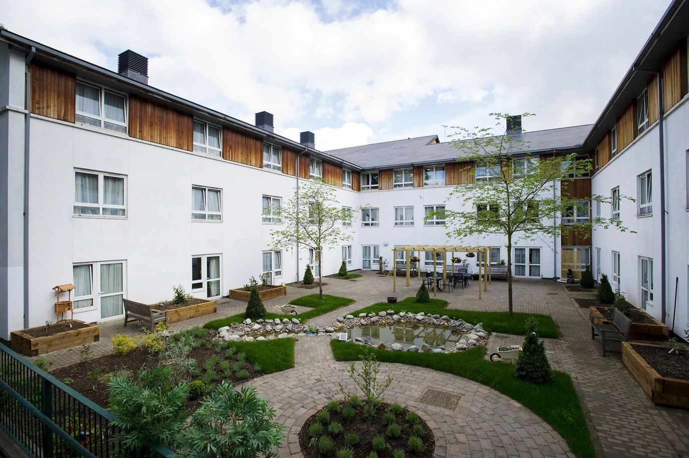 Outdoor courtyard with garden and seating area