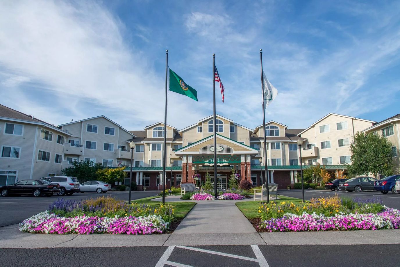 Exterior view of Touchmark at Fairway Village with flowers