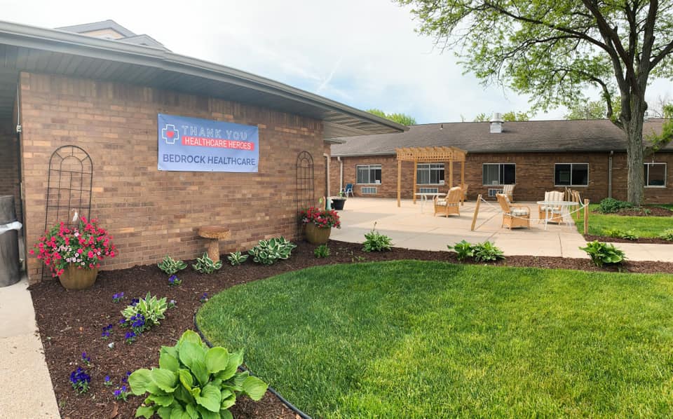 Outdoor courtyard area with seating and flowers