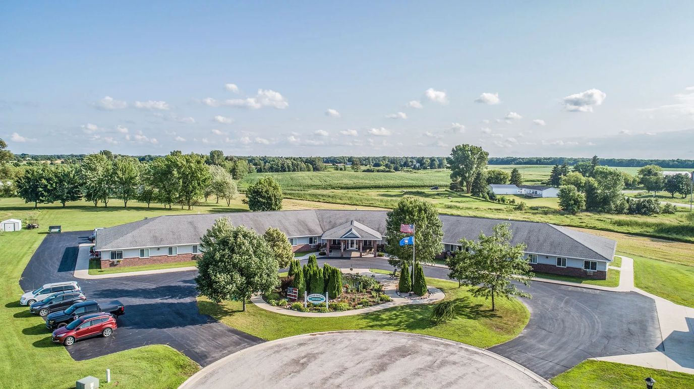 Aerial view of the facility with surrounding nature
