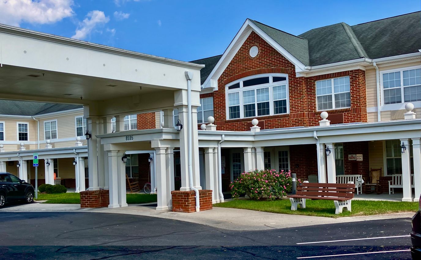 Building exterior with entrance and seating area
