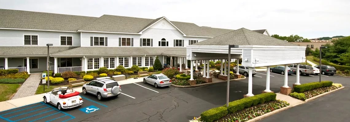 Exterior view of the facility with parking area.