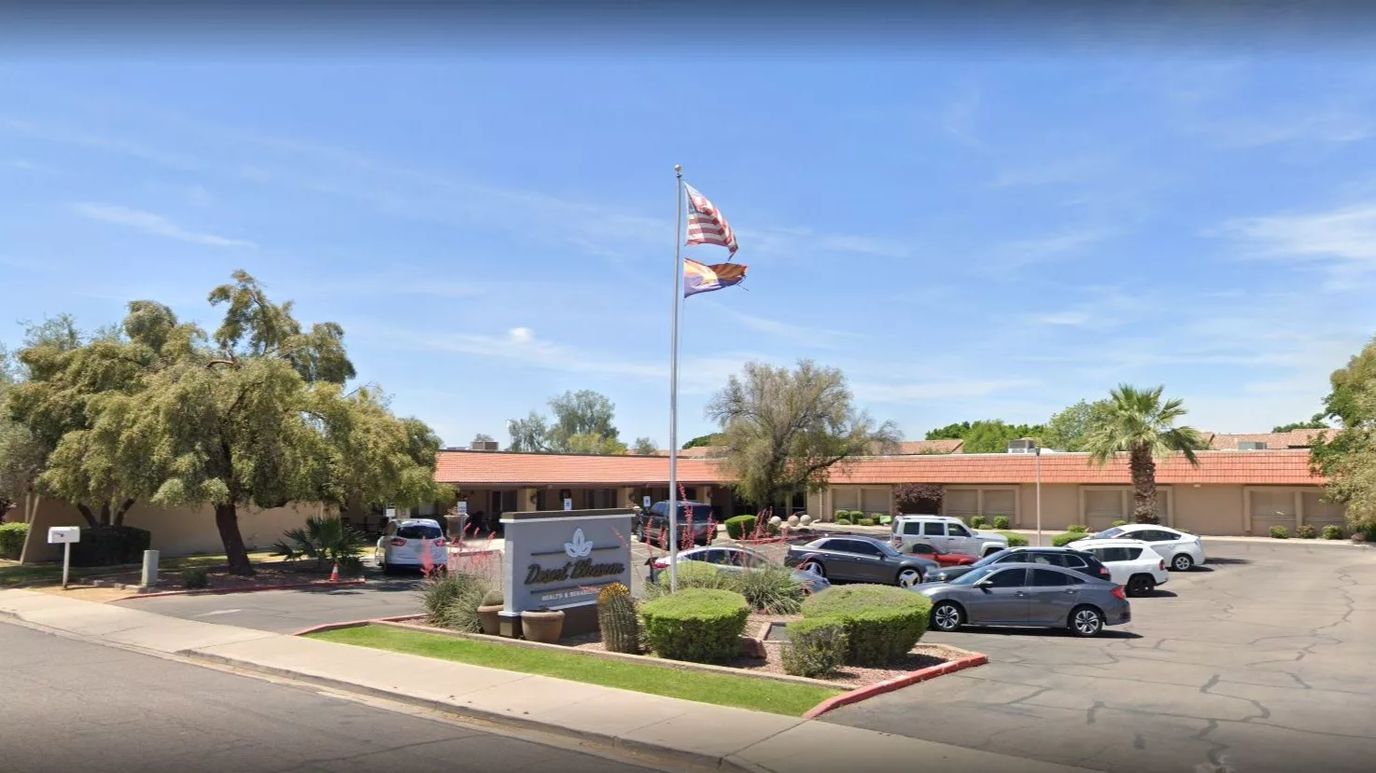 Exterior view of Desert Blossom facility with landscaping