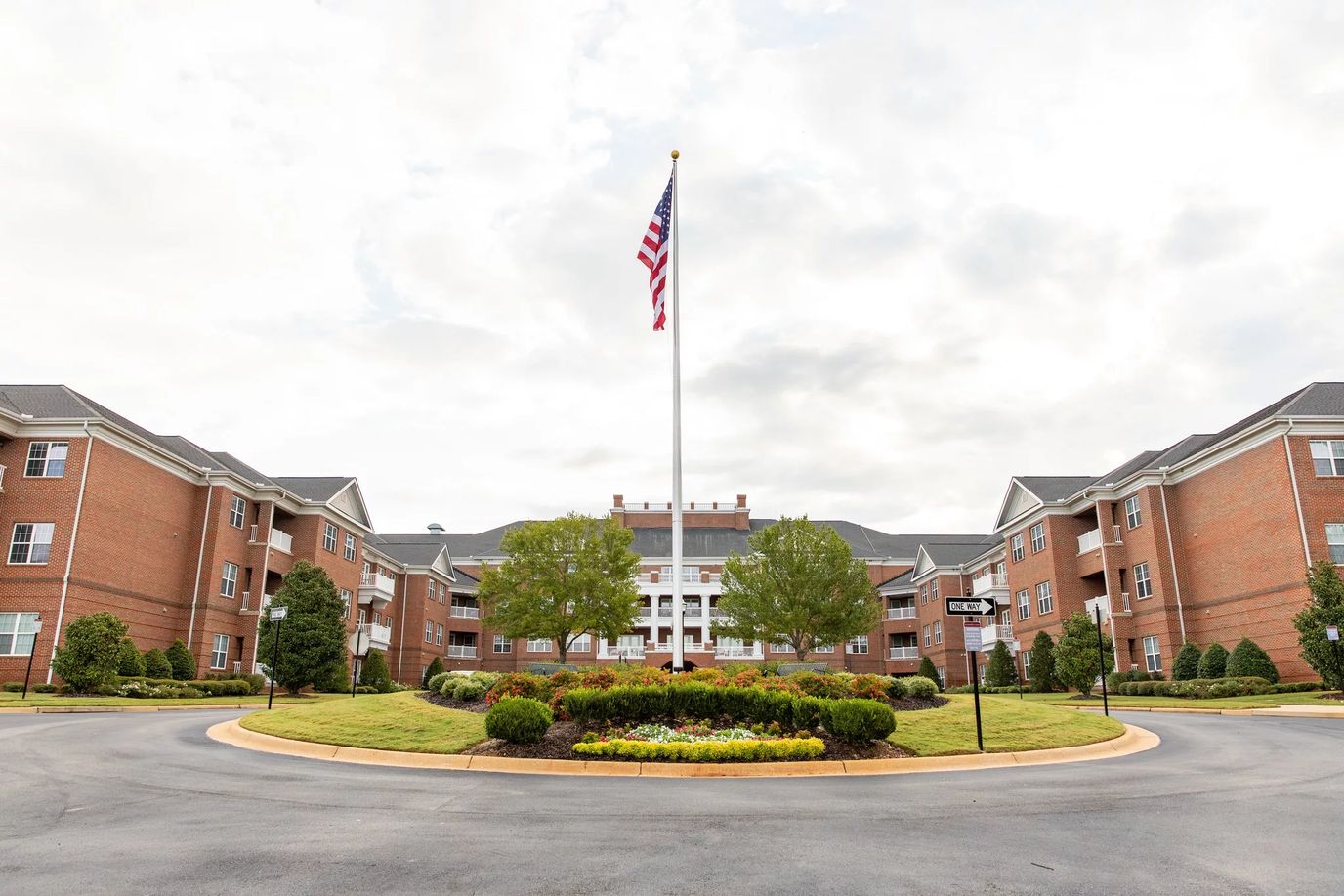 Exterior view of a senior living facility with landscaping