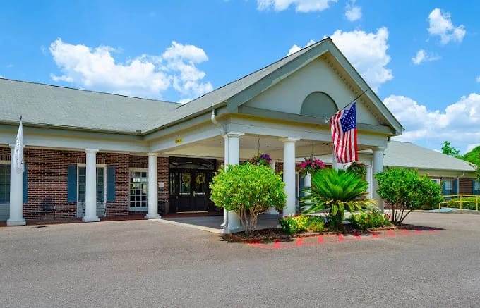 Exterior view of Proveer at Heritage Woods with American flag