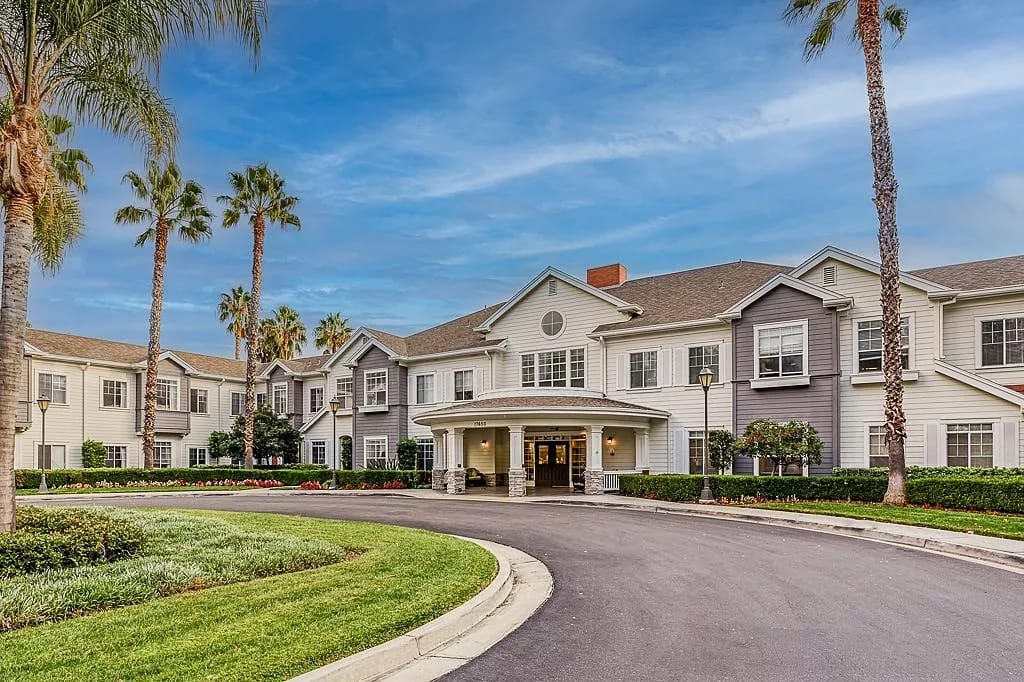 Exterior view of Gardens at Northridge with landscaped entrance