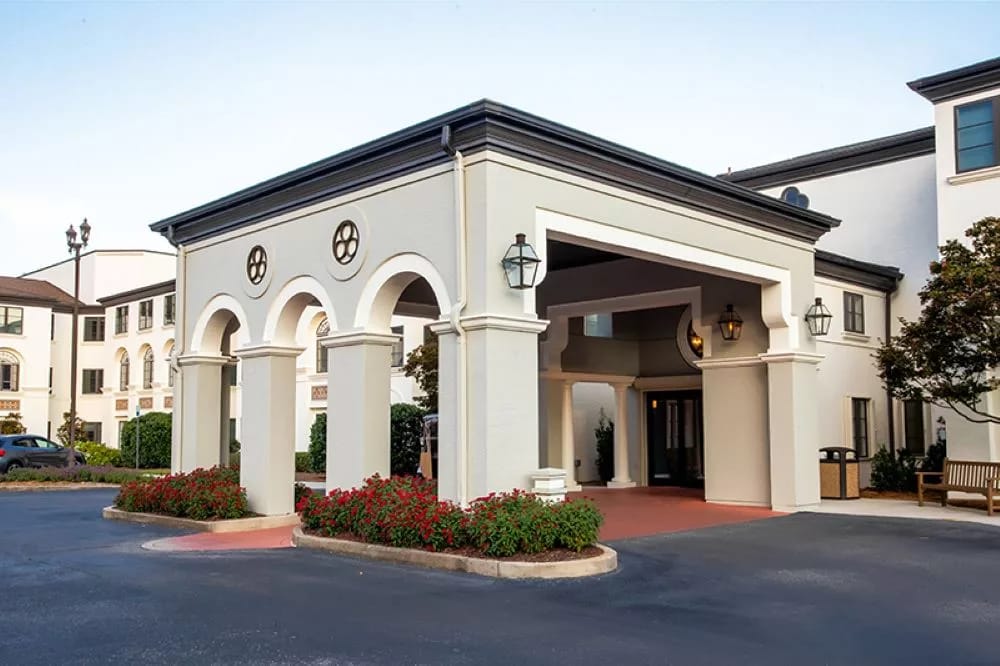 Entrance view of Westminster Village facility with arches