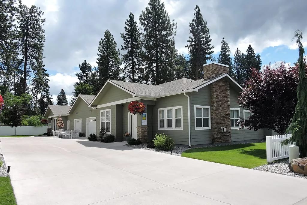 Exterior view of Sunshine Adult Family Home surrounded by trees