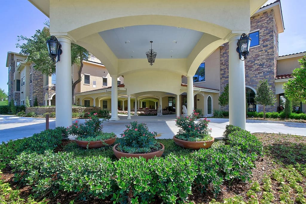 Facade of The Ridgelea Senior Living with landscaped garden