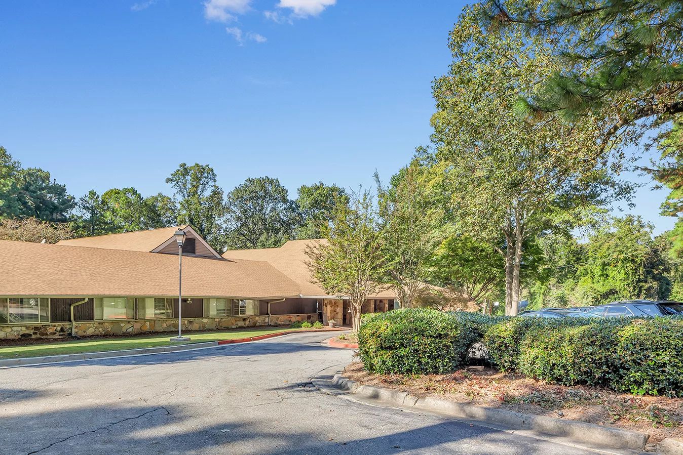Exterior view of the assisted living facility with greenery