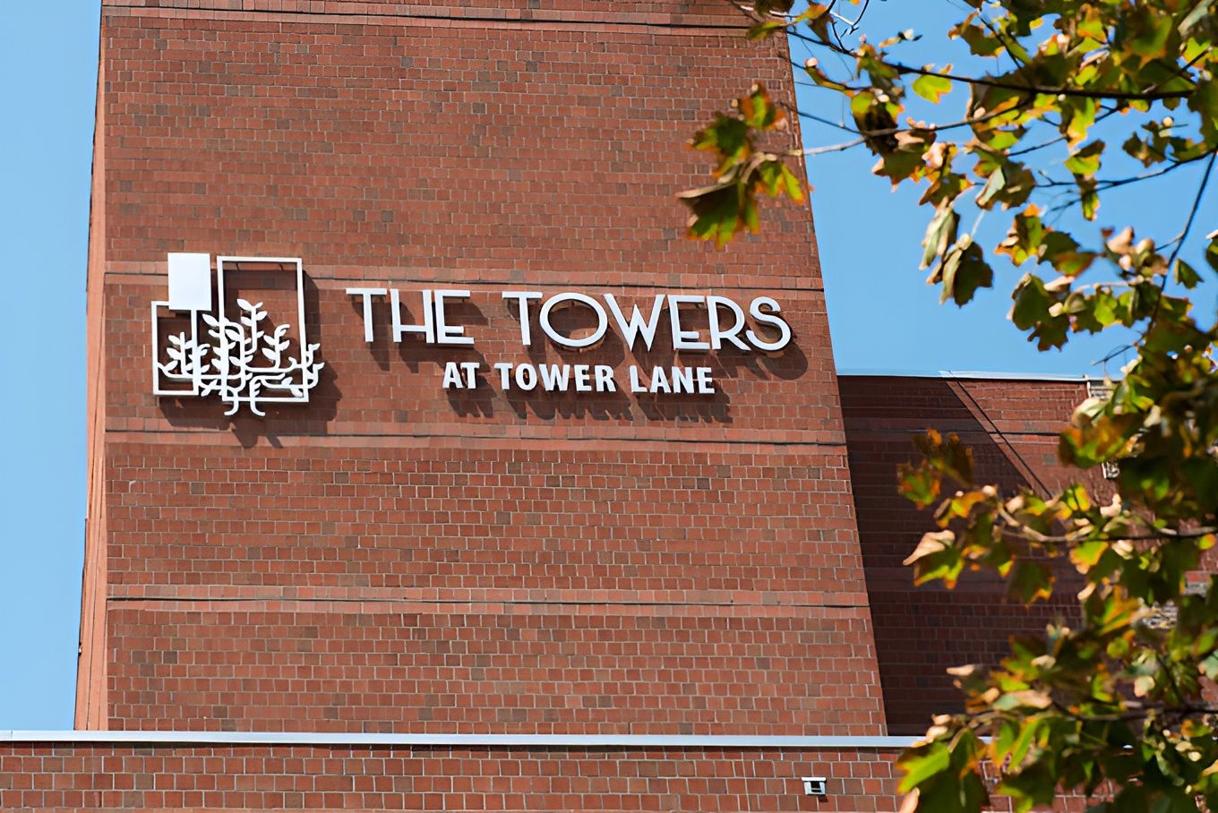 Building signage for The Towers at Tower Lane