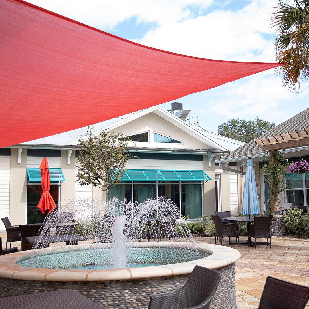 Outdoor courtyard with a fountain and seating area