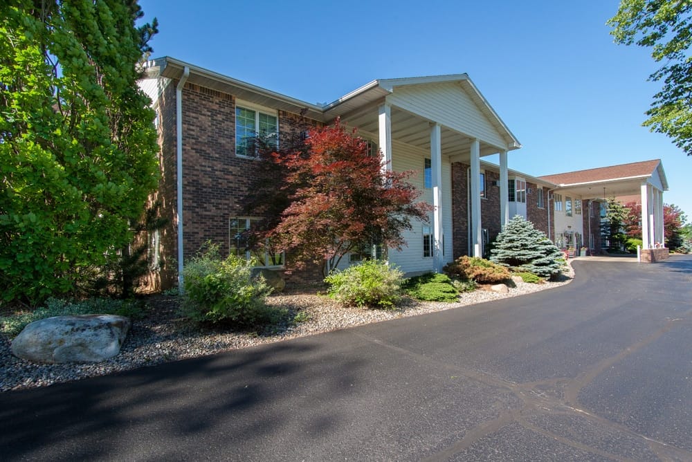 Exterior view of Countryside Manor with landscaping