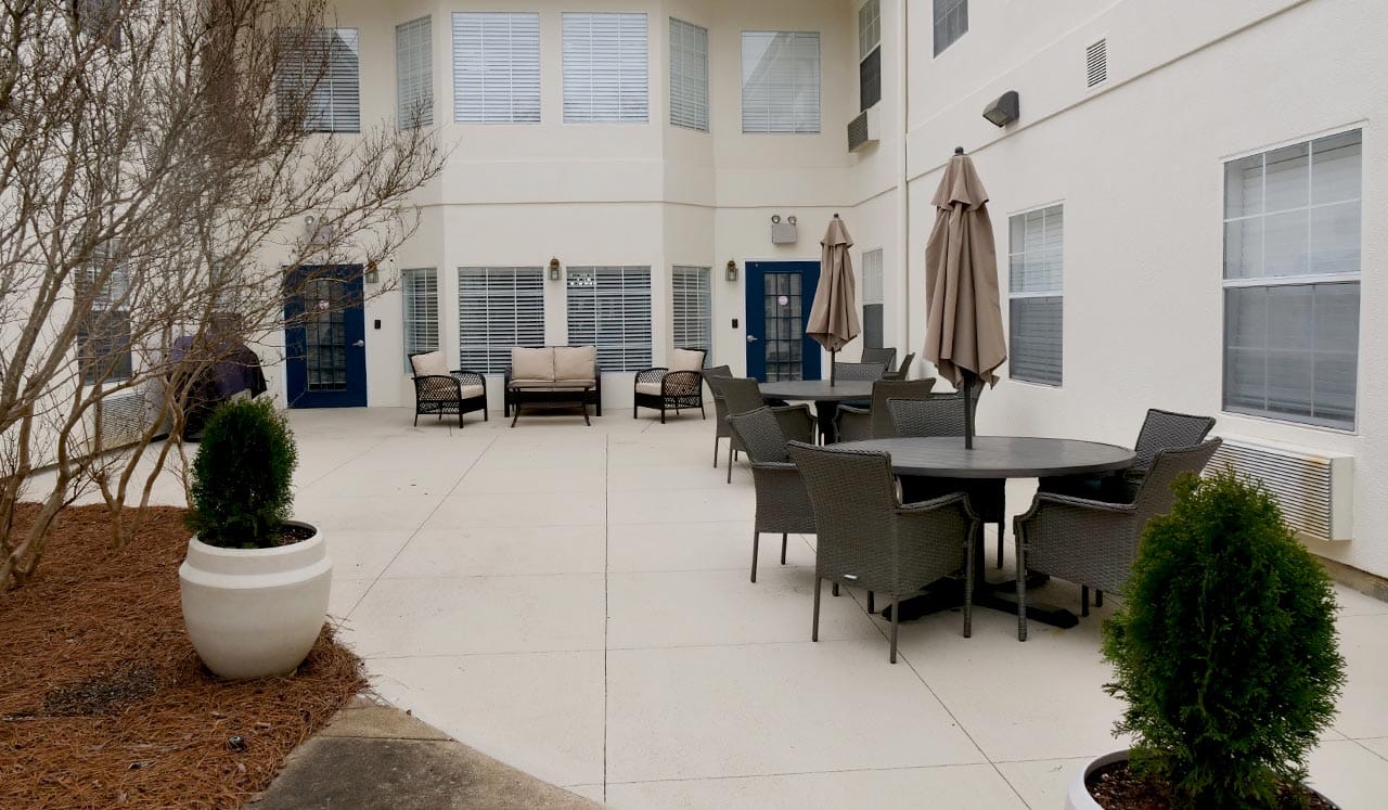 Outdoor patio space with seating and umbrellas