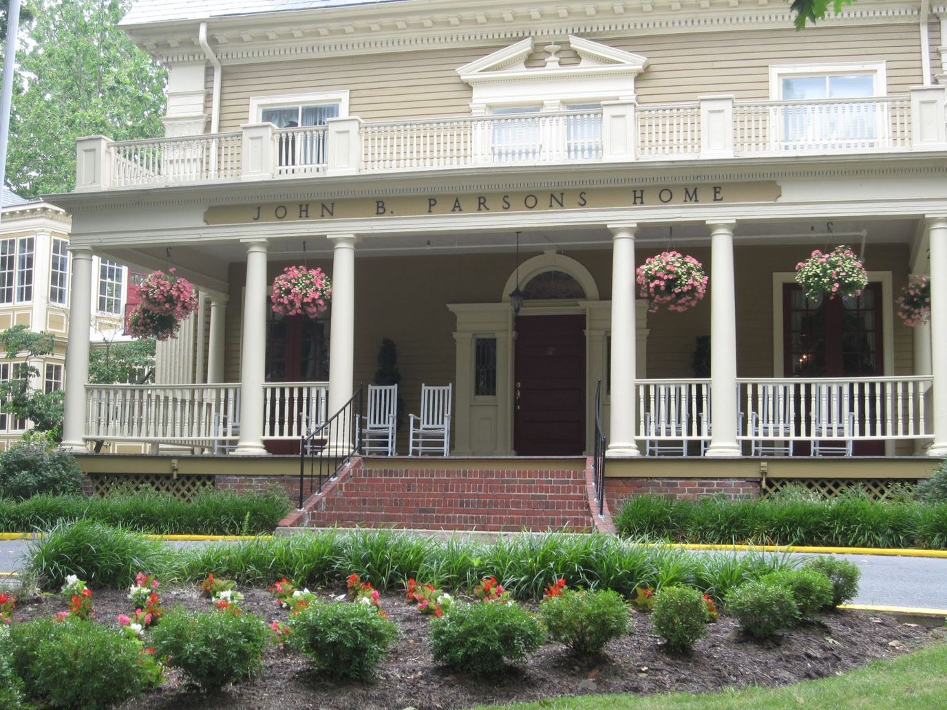 Exterior view of John B. Parsons Home with flower displays