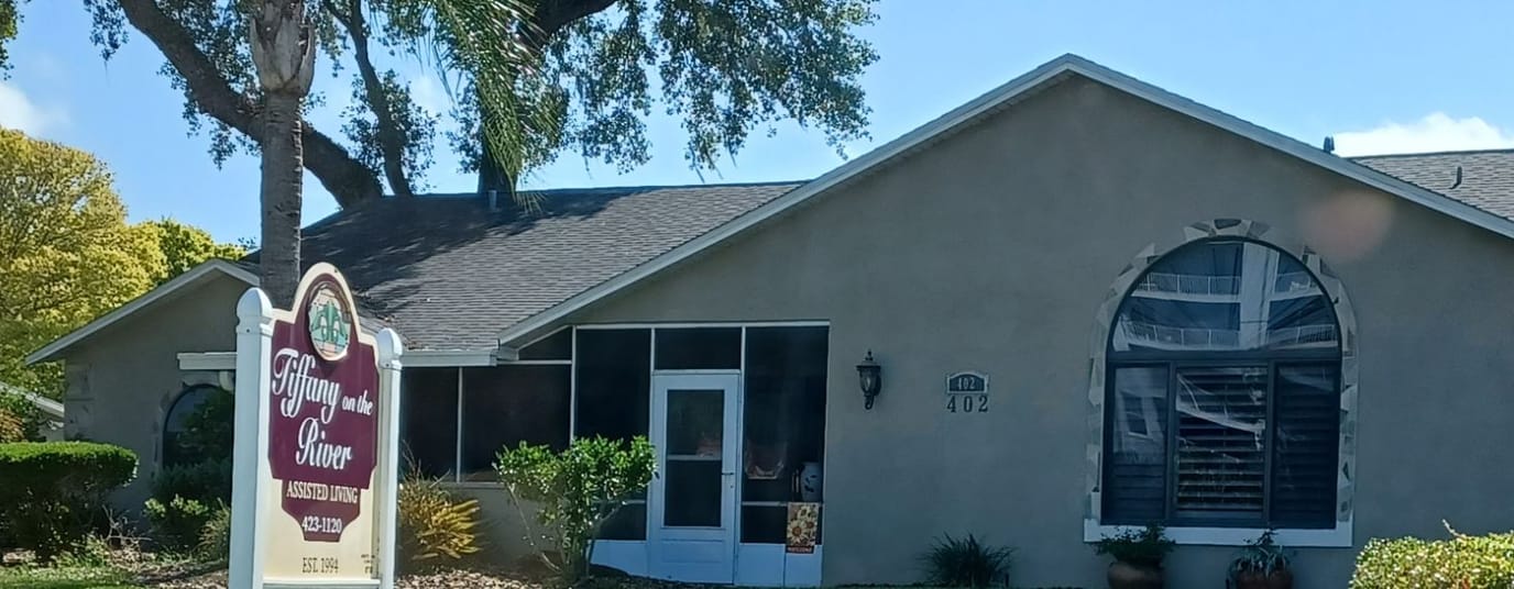 Exterior view of the facility building with signage