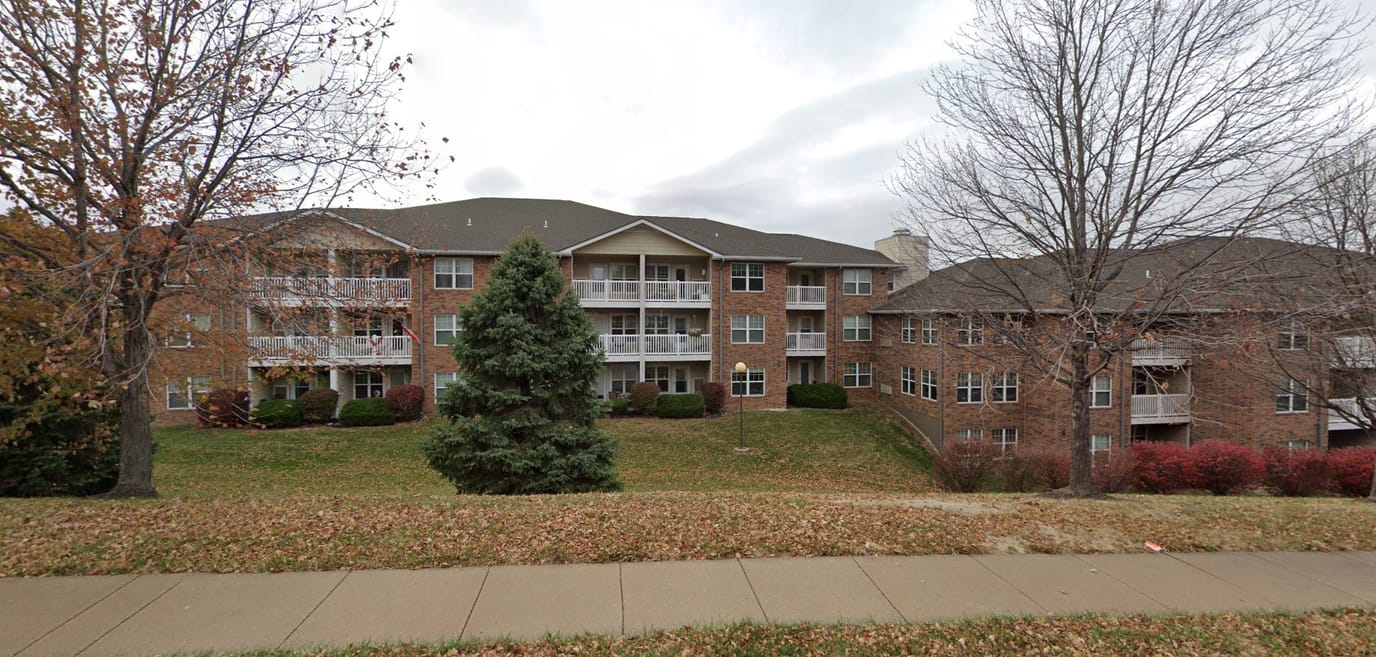Exterior view of Rosewood Place facility with landscaped area