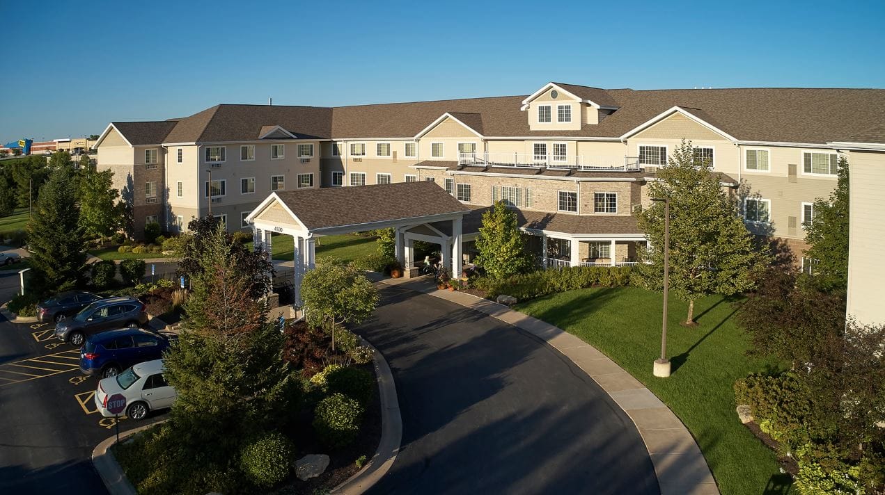 Aerial view of the exterior entrance of a senior living facility