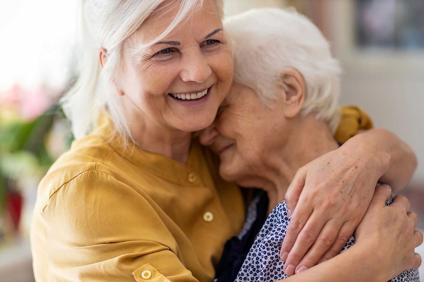 Emerald Crest Of Shakopee, assisted living in Shakopee, MN — Two women embracing in a warm, affectionate moment