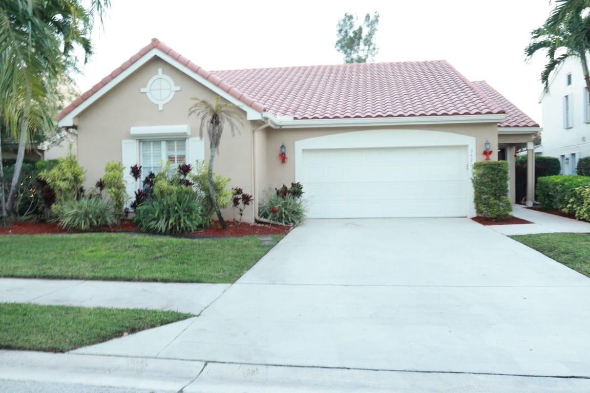 Front exterior of a residential building with landscaping