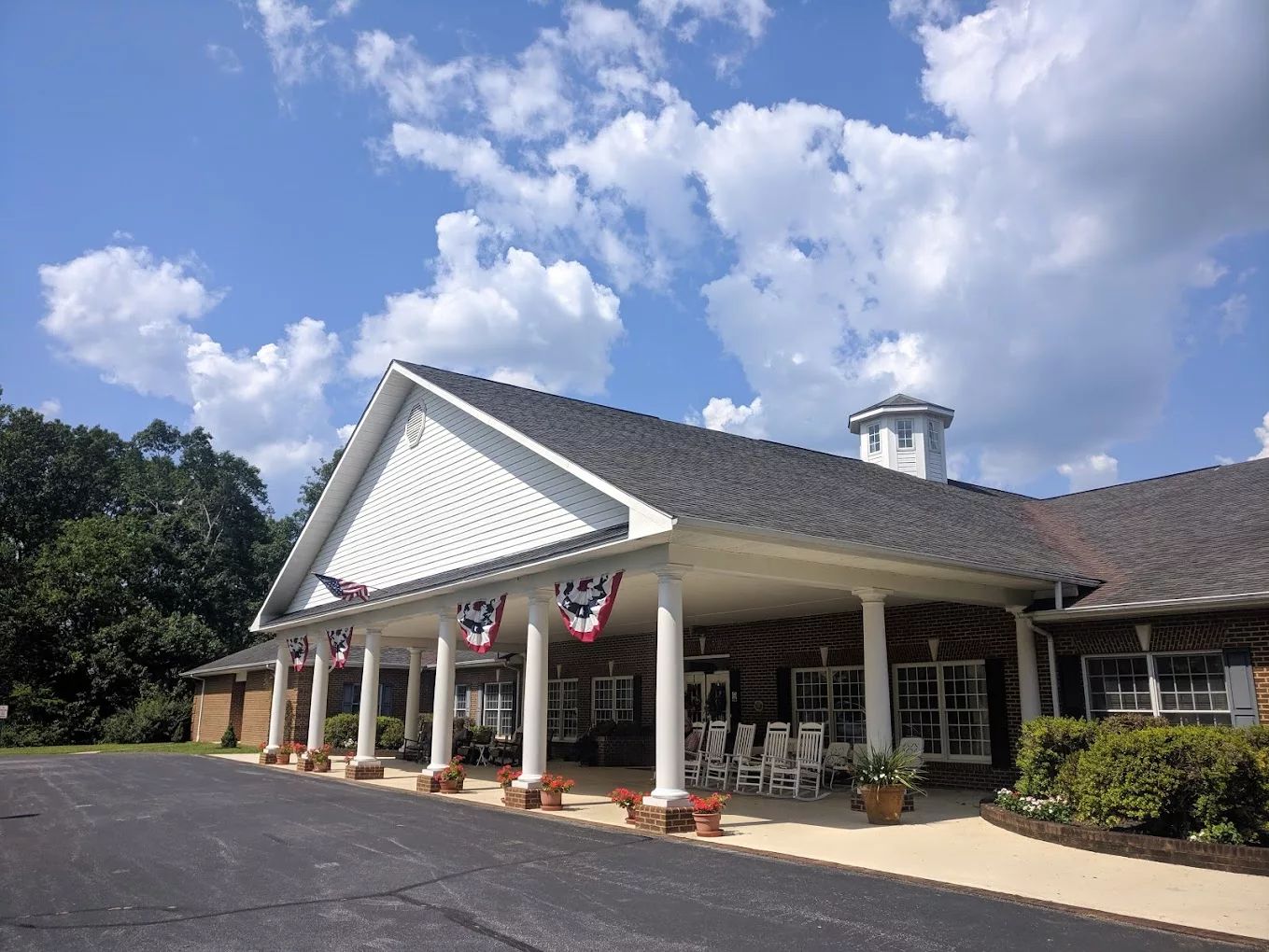 Exterior view of Hickory Hill Retirement Community with patriotic decor
