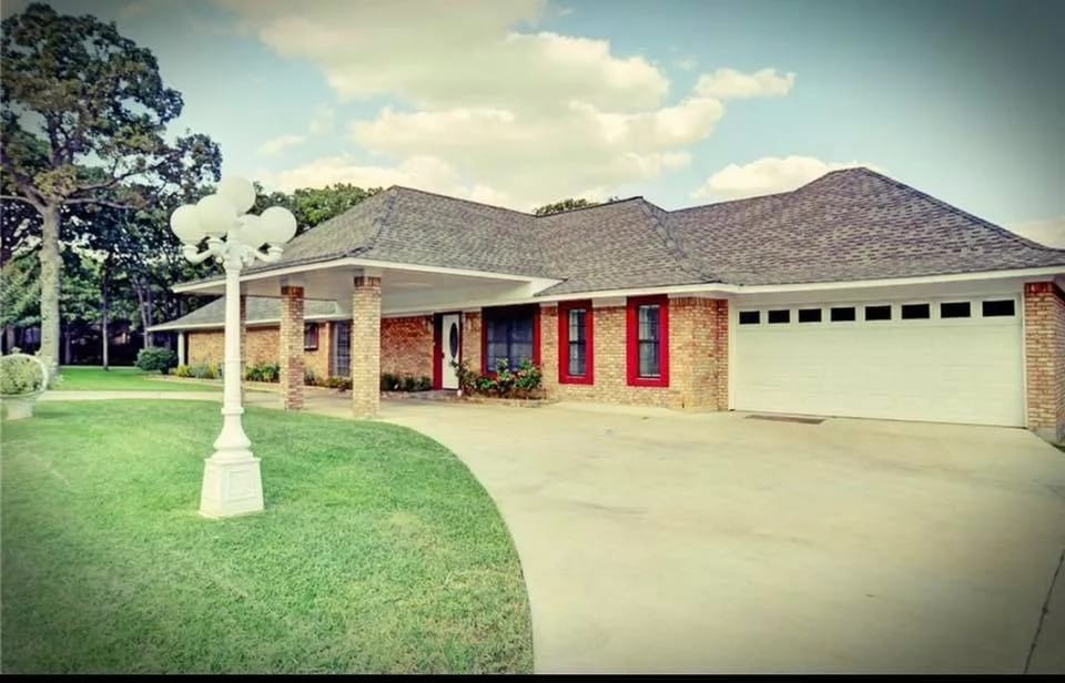 Exterior view of a senior living facility with landscaped garden