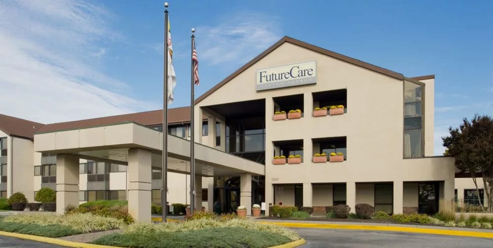Exterior view of FutureCare facility with flags