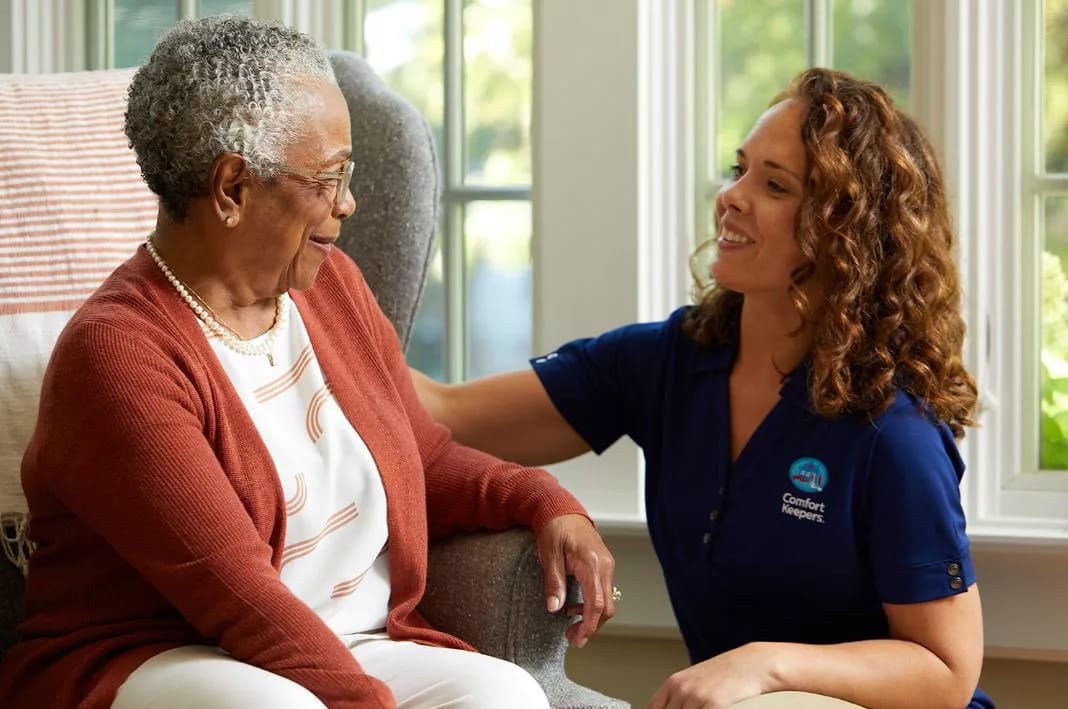 Caregiver interacting with a senior resident