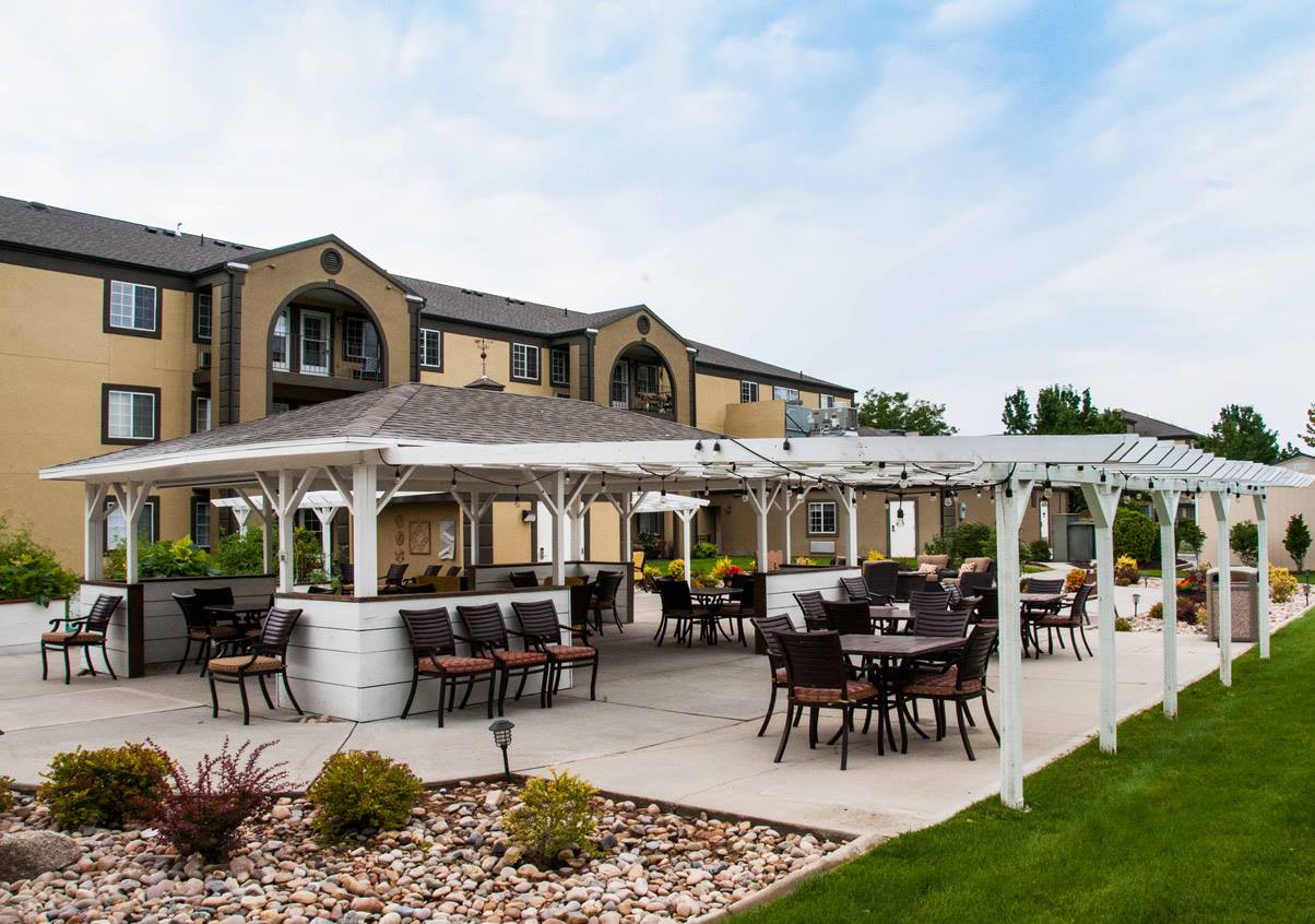 Outdoor seating area with pergolas and gardens