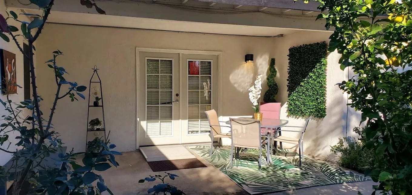 Outdoor patio area with table and chairs