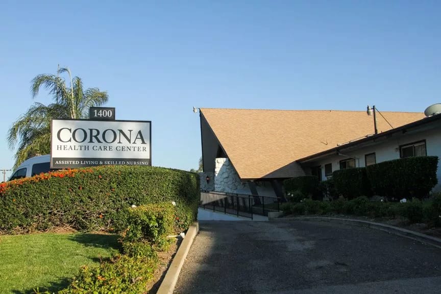 Exterior view of Corona Health Care Center with signage