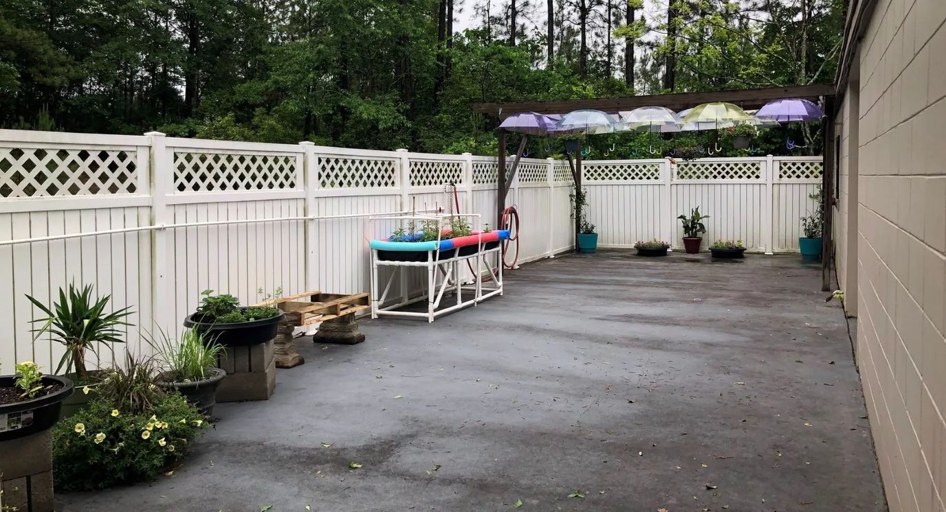 Outdoor space with planters and seating area